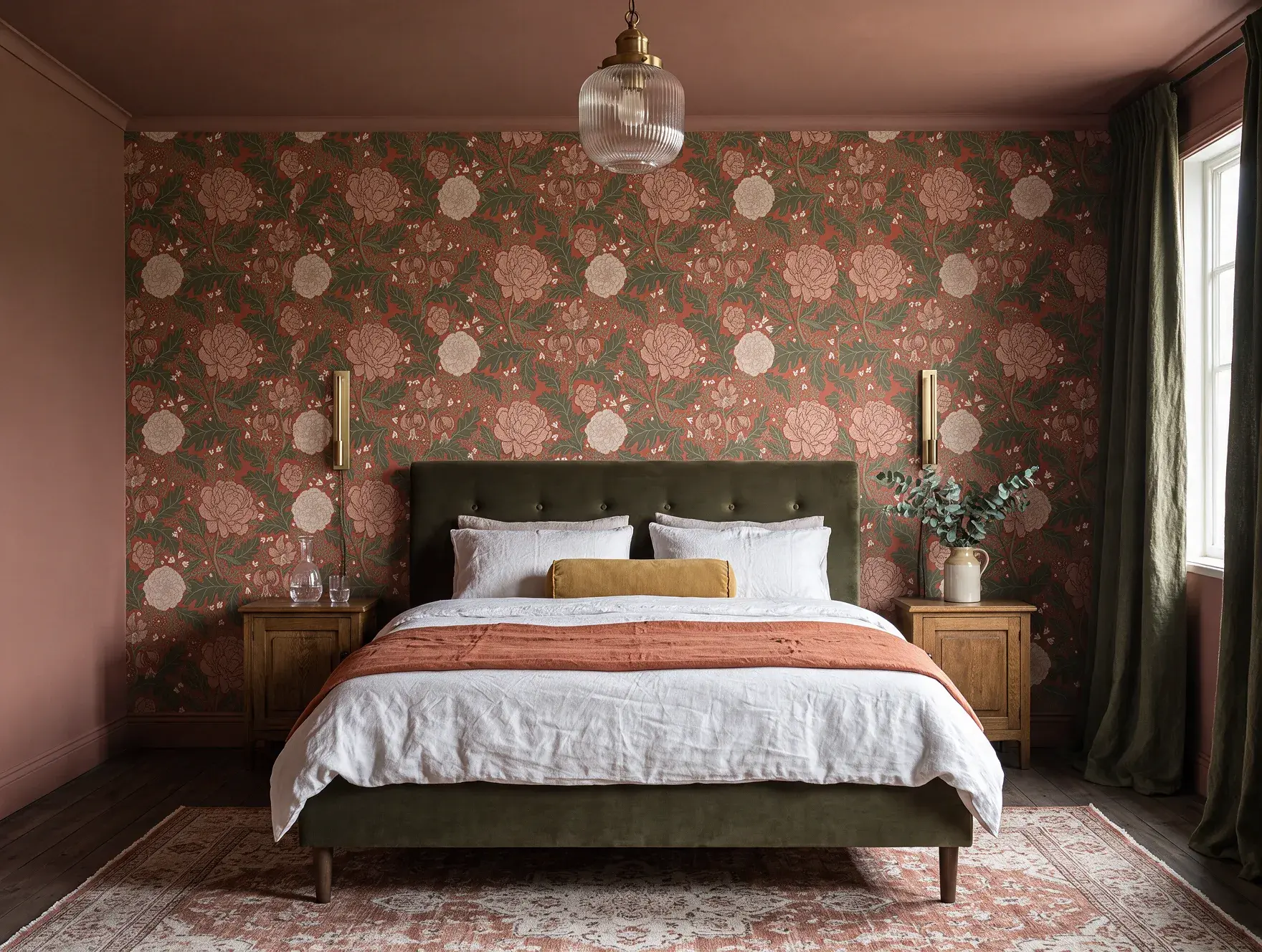 Balanced bedroom with a velvet headboard, matching bedside tables and wall lights, and a rug scaled to the bed
